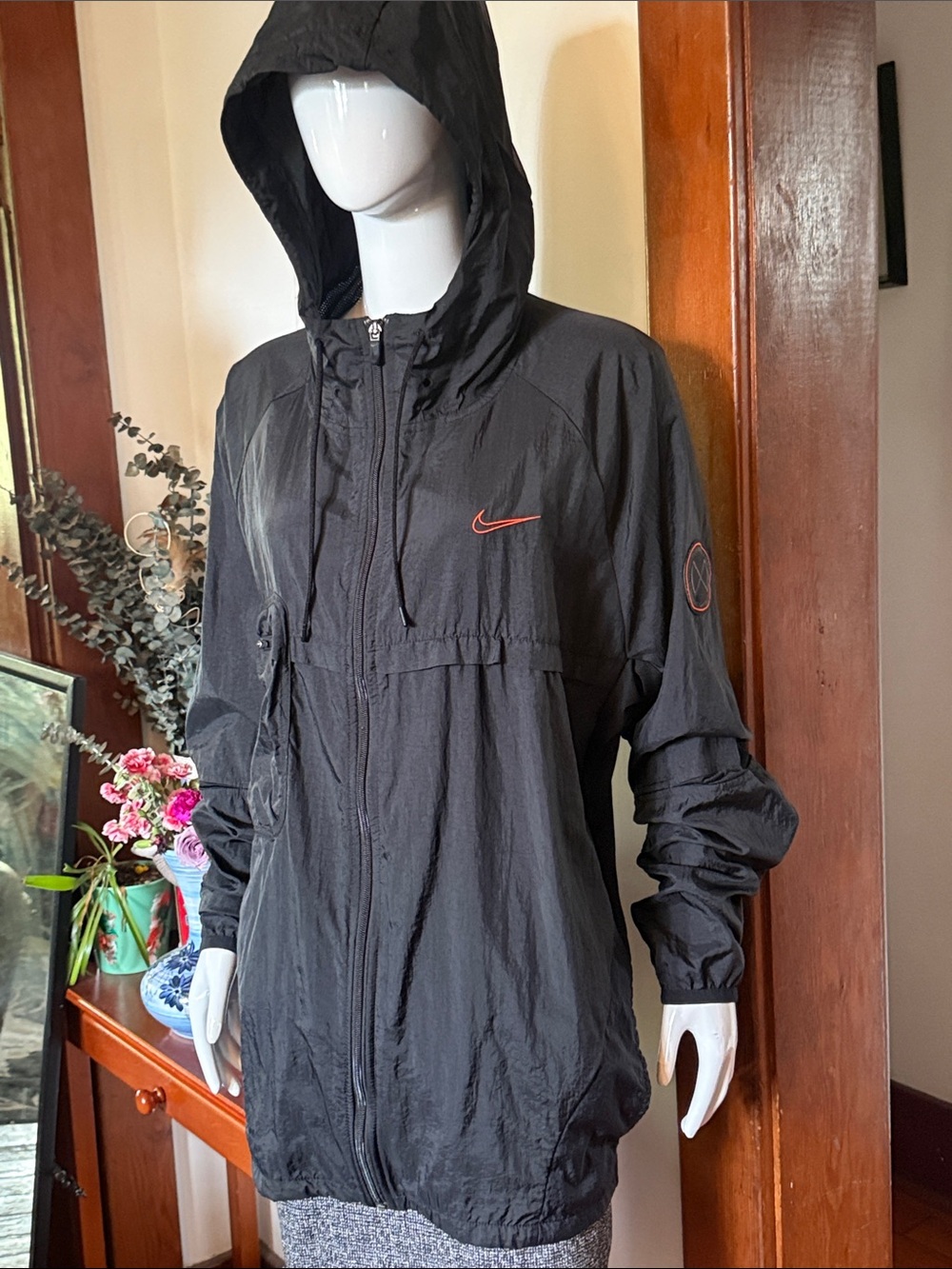 Nike size XL Black Hooded Windbreaker with Red Swoosh Accent